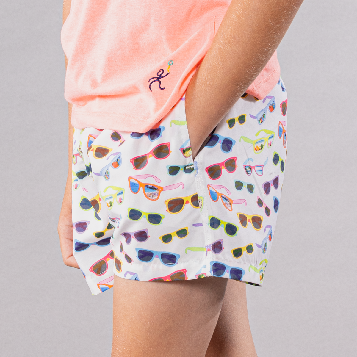 Boy&#39;s white swim trunks with cyclist liner, sunglasses pattern