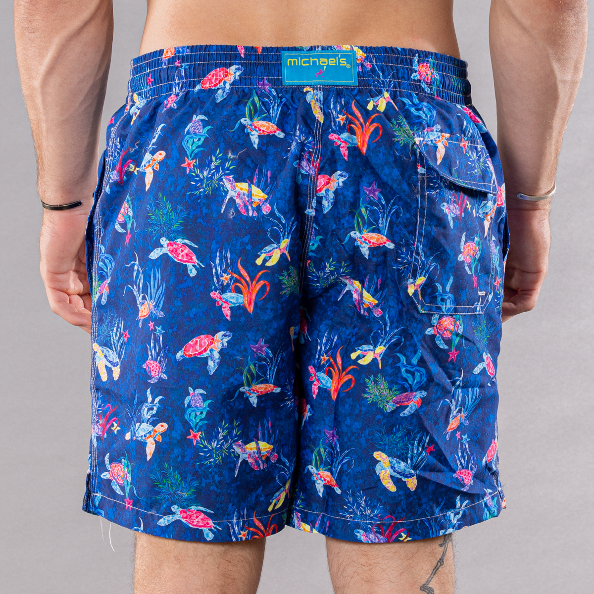 Men&#39;s navy swim trunks with new turtles pattern, back view
