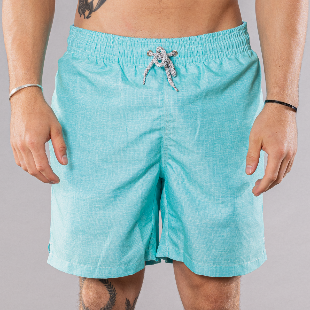 Men&#39;s solid print swim trunks in aqua, front view