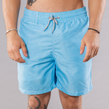 Men's solid print swim trunks in turquoise, front view