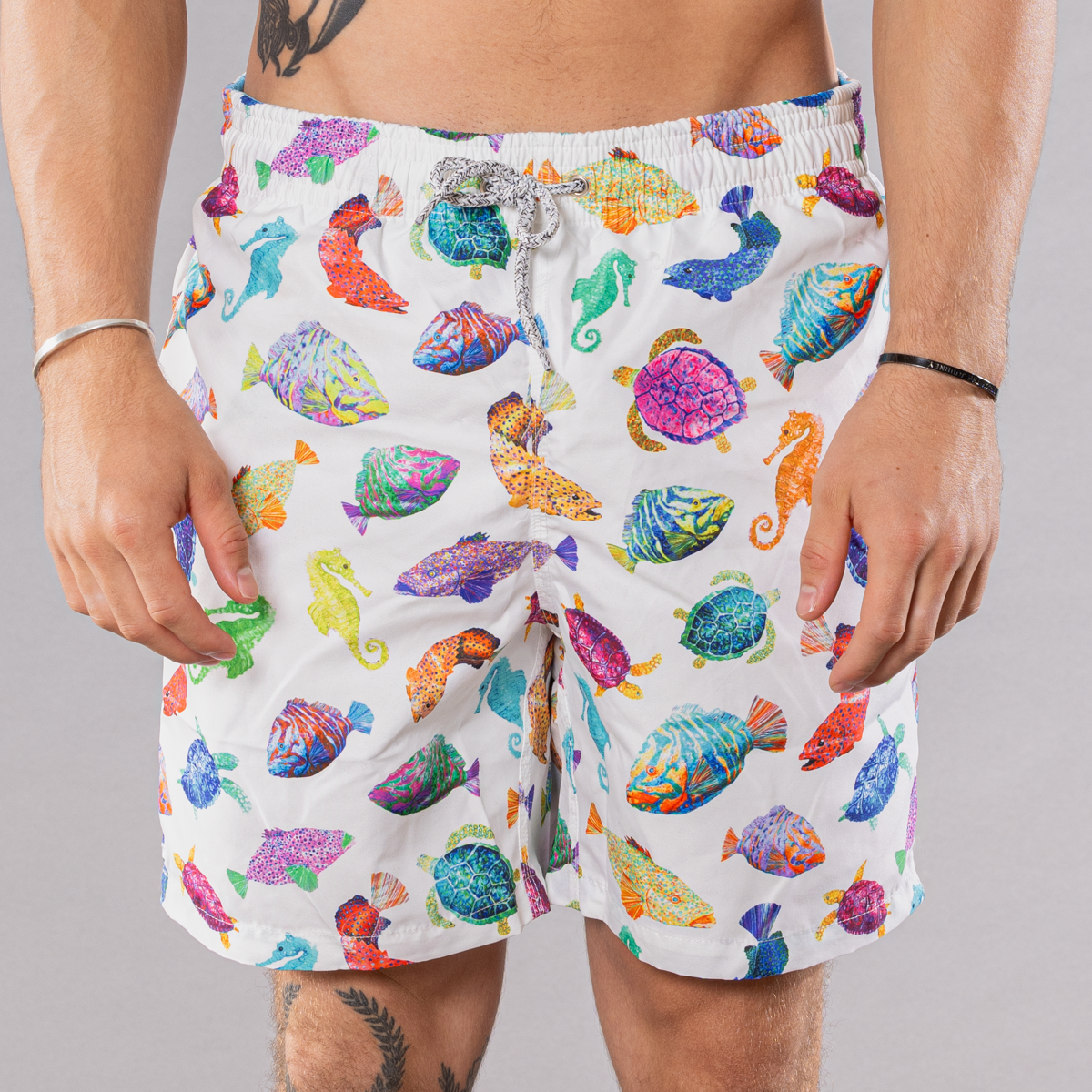 Men&#39;s white swim trunks with cyclist liner, fish chart pattern, front view