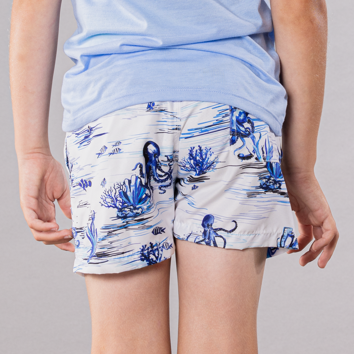 White swim trunks with octopi pattern for boys, back view