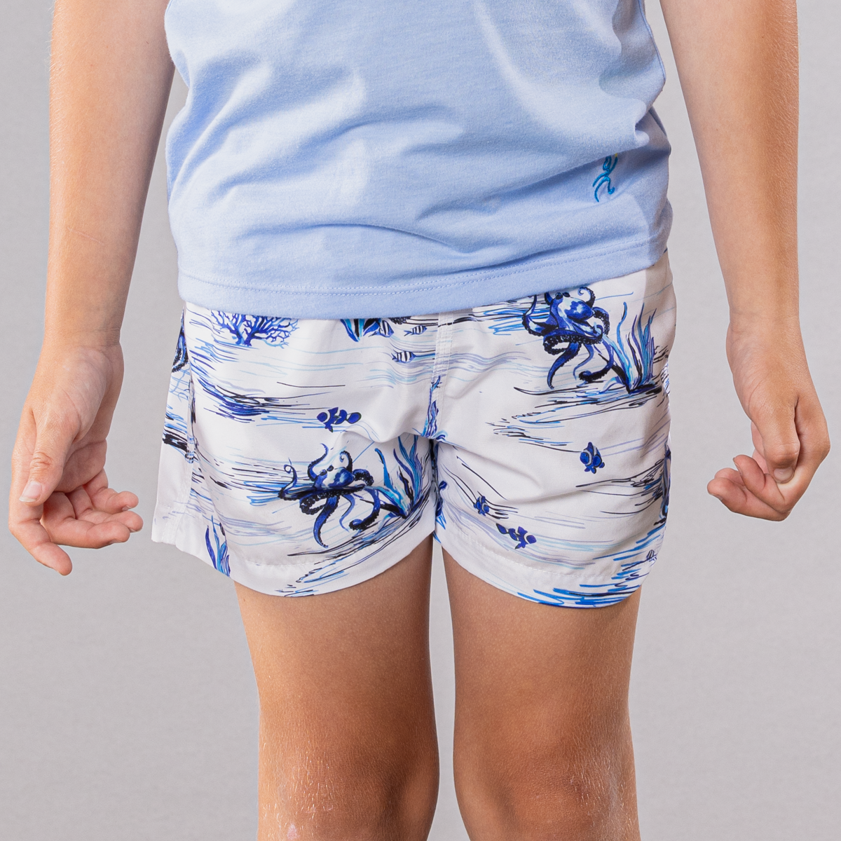 White swim trunks with octopi pattern for boys, front view